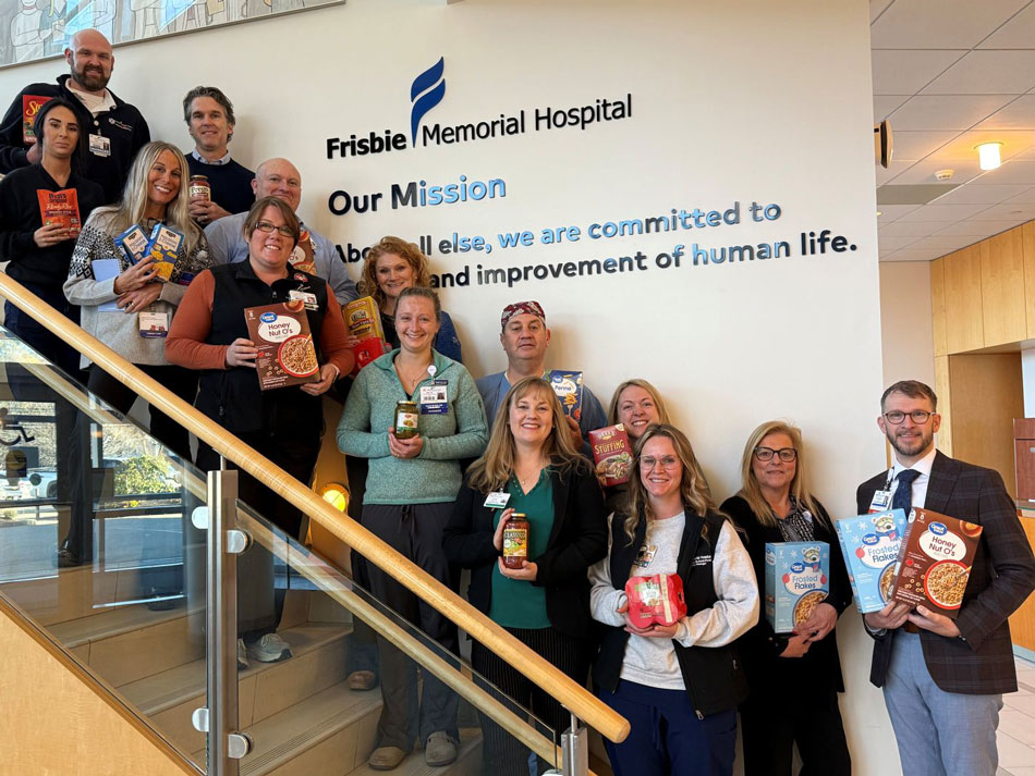 colleagues from Portsmouth Regional Hospital gathered around donated food items