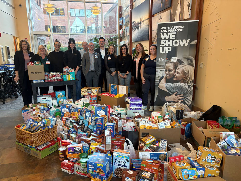 colleagues from Parkland Medical Center colleagues gathered around donated food items